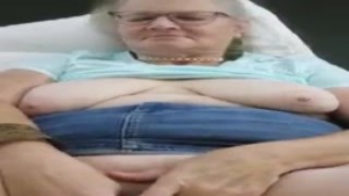 As my horny granny slut mom strokes her wet cunt, she moans loudly in pleasure