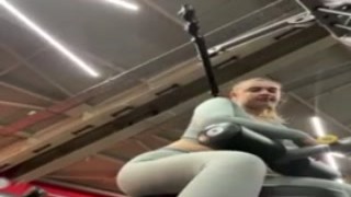 She sat on her sweaty ass, bent over the bench press, while he fucked her with his massive cock