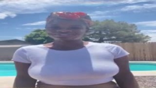 The busty Tiana was sitting in front of the camera, her massive tits spilling out of her top as she gave a sultry smile