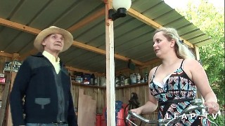 Wanton blonde haired streetwalker sucks hard dick of her client outdoors