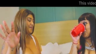 The scene begins with Vixan V teasing the camera with her ample cleavage and sexy pink lingerie