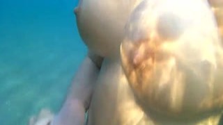 With her big tits bouncing up and down on his hard cock, Alex couldnt believe she was going to suck him off right there in front of all the other beachgoers
