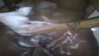 Laying back on the bed, I reached out my hand and gripped her elephant trunk-like legs, pulling her closer to me