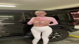 Kandis shaved bald head glistened in the sun as she squirted from her pussy while riding the parking lot dildo