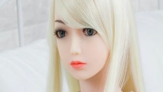 The blonde mini love doll has big tits that are perfect for sucking on while she gives you a blowjob