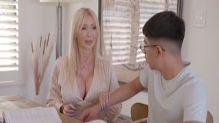 The sexy cougar tutor sat at her desk, her big tits spilling out of her tight top