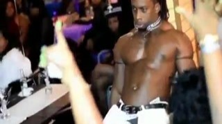 The slutty stripper undid her bra, revealing her huge tits to the audience