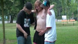 The horny teenage slut was sucking both cocks at once, deep throating each one to the balls while the guys fucked her tight pussy in unison, her juices dripping down their cocks as she moaned and gasped with pleasure