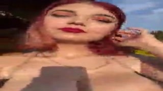 The sun was warm on her skin as she stripped off her top, showing off her perky tits to the world