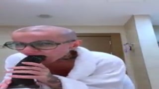 She was sitting on the bed, her thighs spread wide, a massive dildo thrusting into her wet pussy