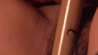 Pure Japanese adult video - Horny Japanese teen with glasses plays with her hairy cunt on the floor