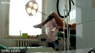 She moaned loudly as the gyno slid his fingers deep into her wet pussy