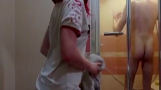 She slowly unzipped her tight black dress, letting it fall to the floor