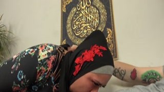 A busty woman in a hijab got a really hard gift